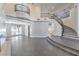 Two-story living room with high ceilings and a grand staircase at 5423 San Florentine Ave, Las Vegas, NV 89141