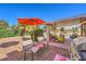 Patio with seating area, grill, and artificial turf at 5604 Ocean Pines Cir, Las Vegas, NV 89130