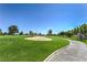 Landscaped golf course with sand trap and walking path at 5604 Ocean Pines Cir, Las Vegas, NV 89130