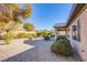 Landscaped backyard with gravel and desert plants at 5944 Saddle Horse Ave, Las Vegas, NV 89122