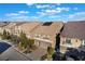 Aerial view of a two story house with solar panels and driveway at 5956 Lambert Bridge Ave, Las Vegas, NV 89139