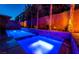 Night view of a modern backyard pool at 5956 Lambert Bridge Ave, Las Vegas, NV 89139
