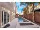 Daytime view of a modern backyard pool and fire pit at 5956 Lambert Bridge Ave, Las Vegas, NV 89139