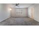 Bright and airy bedroom with ceiling fan and carpet at 5956 Lambert Bridge Ave, Las Vegas, NV 89139