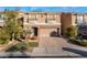 Two-story house with attached garage and paved driveway at 5956 Lambert Bridge Ave, Las Vegas, NV 89139