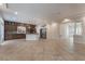 Open concept kitchen with island and stainless steel appliances at 5956 Lambert Bridge Ave, Las Vegas, NV 89139