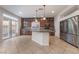 Kitchen with wood cabinets, granite countertops, and island at 5956 Lambert Bridge Ave, Las Vegas, NV 89139