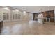 Open concept living room and kitchen with tile floors at 5956 Lambert Bridge Ave, Las Vegas, NV 89139