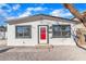 Newly renovated single story home with a red door at 6120 Kimberly Cir, Las Vegas, NV 89107