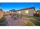 Landscaped backyard with gazebo and patio seating at night at 6160 Lautman Ridge Ct, Las Vegas, NV 89141