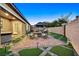 Backyard patio at dusk with gazebo, hot tub, and seating area at 6160 Lautman Ridge Ct, Las Vegas, NV 89141