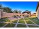 Night view of backyard with gazebo and patio furniture at 6160 Lautman Ridge Ct, Las Vegas, NV 89141
