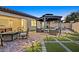 Backyard with gazebo, patio furniture, and artificial turf at dusk at 6160 Lautman Ridge Ct, Las Vegas, NV 89141