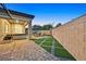 Evening view of backyard with hot tub and patio area at 6160 Lautman Ridge Ct, Las Vegas, NV 89141