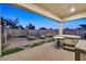 Evening view of backyard with hot tub, gazebo, and patio furniture at 6160 Lautman Ridge Ct, Las Vegas, NV 89141
