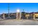 Gated community entrance with stone pillars and wrought iron gates at 6160 Lautman Ridge Ct, Las Vegas, NV 89141