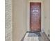 Modern front door with geometric metal design and a welcome mat at 6160 Lautman Ridge Ct, Las Vegas, NV 89141