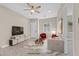 Virtually staged living room with herringbone floors at 6160 Lautman Ridge Ct, Las Vegas, NV 89141