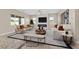 Virtually staged living room with comfortable seating and a modern fireplace at 6160 Lautman Ridge Ct, Las Vegas, NV 89141