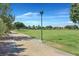 Pathway through grassy park area with trees and lamp post at 6160 Lautman Ridge Ct, Las Vegas, NV 89141