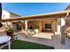 Covered patio with seating area, a shed, and a grill at 6349 Heather Creek Place Pl, Las Vegas, NV 89122