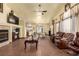 Bright living room with hardwood floors, fireplace and comfortable seating at 6349 Heather Creek Place Pl, Las Vegas, NV 89122