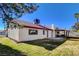 Spacious backyard with large patio and grassy area at 6466 Scotch Pine Cir, Las Vegas, NV 89146