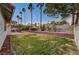 Backyard with covered patio and grass at 6466 Scotch Pine Cir, Las Vegas, NV 89146