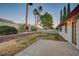 Landscaped backyard with grass, patio and trees at 6466 Scotch Pine Cir, Las Vegas, NV 89146
