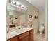Clean bathroom with shower, toilet and wood vanity at 6466 Scotch Pine Cir, Las Vegas, NV 89146