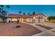 Brick house with a two-car garage and a landscaped front yard at 6466 Scotch Pine Cir, Las Vegas, NV 89146