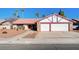 Single-story home with two-car garage and landscaped front yard at 6466 Scotch Pine Cir, Las Vegas, NV 89146