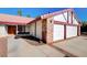 Brick house with a two-car garage and well-maintained landscaping at 6466 Scotch Pine Cir, Las Vegas, NV 89146
