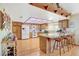 Kitchen features wood cabinets, breakfast bar, and a skylight at 6466 Scotch Pine Cir, Las Vegas, NV 89146