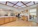 Spacious kitchen with wood cabinets, white appliances, and a large island at 6466 Scotch Pine Cir, Las Vegas, NV 89146