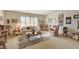 Spacious living room featuring a comfortable seating area and large windows at 6466 Scotch Pine Cir, Las Vegas, NV 89146