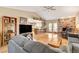 Spacious living room with hardwood floors, open floor plan, and brick fireplace at 6466 Scotch Pine Cir, Las Vegas, NV 89146