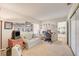 Home office with sofa, desk, and ample natural light at 6466 Scotch Pine Cir, Las Vegas, NV 89146