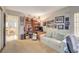 Spacious home office with built-in shelving and comfortable seating at 6466 Scotch Pine Cir, Las Vegas, NV 89146