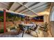 Covered patio with table and chairs at 6466 Scotch Pine Cir, Las Vegas, NV 89146