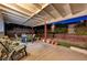 Covered patio with seating area and potted plants at 6466 Scotch Pine Cir, Las Vegas, NV 89146