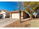 House exterior with a driveway and landscaping at 7258 Rock Castle Ave, Las Vegas, NV 89130