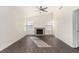 Living room with fireplace and wood-look floors at 7748 Selby Ct, Las Vegas, NV 89147