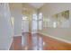 Living room with hardwood floors, staircase, and large window at 8113 Bay Springs Dr, Las Vegas, NV 89128