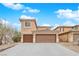 Two-story house with brown garage doors and neutral exterior at 8356 San Mateo St, North Las Vegas, NV 89085