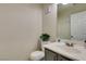 Powder room with a toilet and pedestal sink at 9100 Spoonbill Ridge Pl, Las Vegas, NV 89143