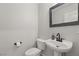 Small bathroom with pedestal sink, toilet and black fixtures at 104 Masserta Ct, Las Vegas, NV 89183