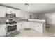 Modern kitchen with white cabinets, stainless steel appliances, and gray countertops at 104 Masserta Ct, Las Vegas, NV 89183