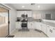 Modern kitchen with white cabinets and stainless steel appliances at 104 Masserta Ct, Las Vegas, NV 89183