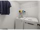 Convenient laundry room with washer, dryer, and shelving at 104 Masserta Ct, Las Vegas, NV 89183